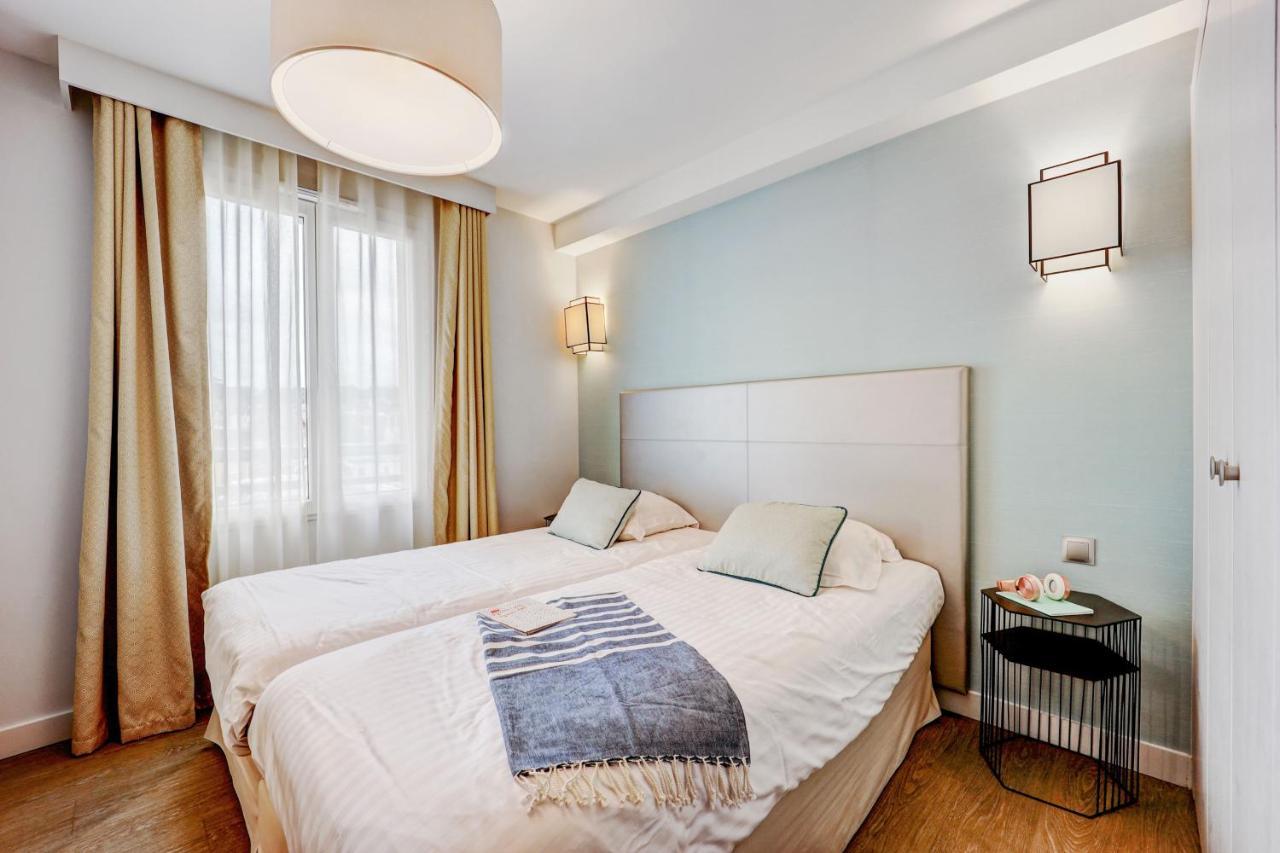 Résidence Pierre&Vacances Premium Presqu'Ile de la Touques Deauville Esterno foto A bedroom
